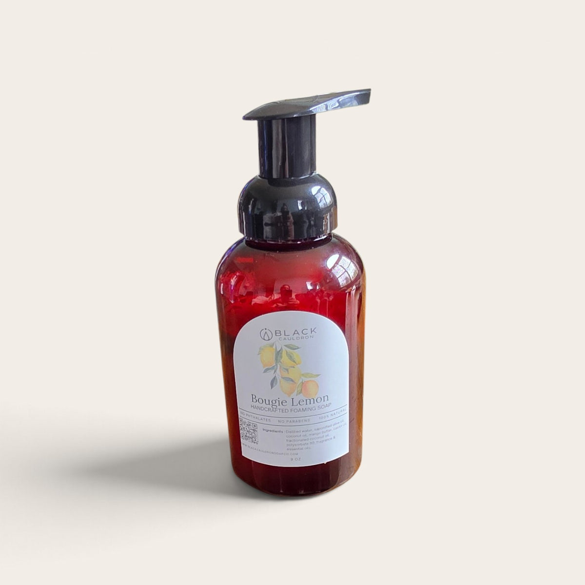 Bougie Lemon foaming hand soap in an amber bottle with a black pump against a textured cream background.