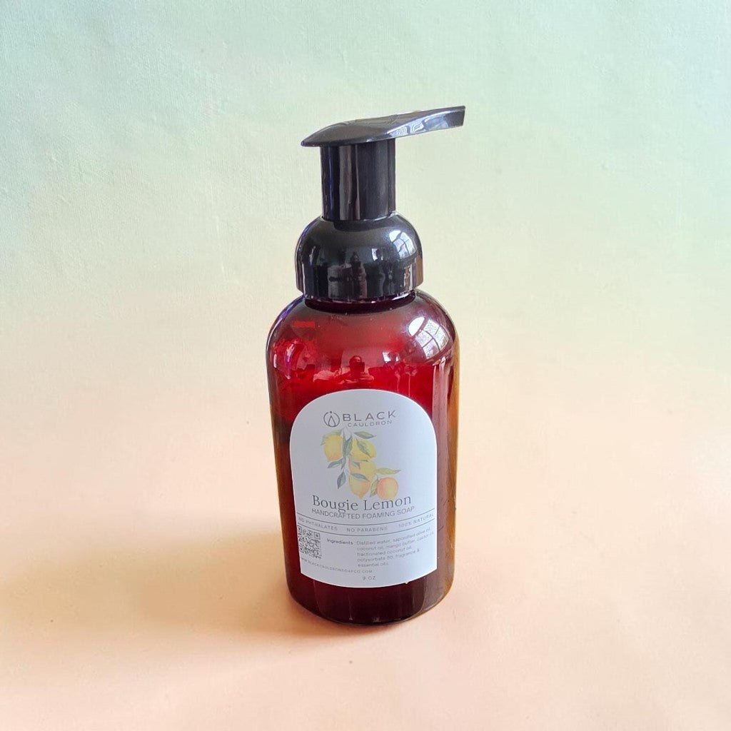 Bougie Lemon foaming hand soap in an amber bottle with a black pump against a textured cream background.