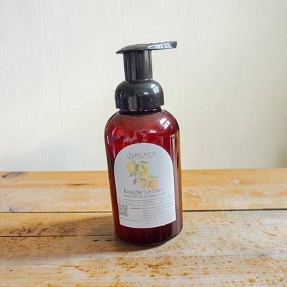 Bougie Lemon foaming hand soap in an amber bottle with a black pump against a textured cream background.