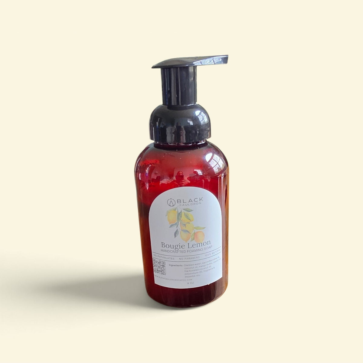 Bougie Lemon foaming hand soap in an amber bottle with a black pump against a textured cream background.