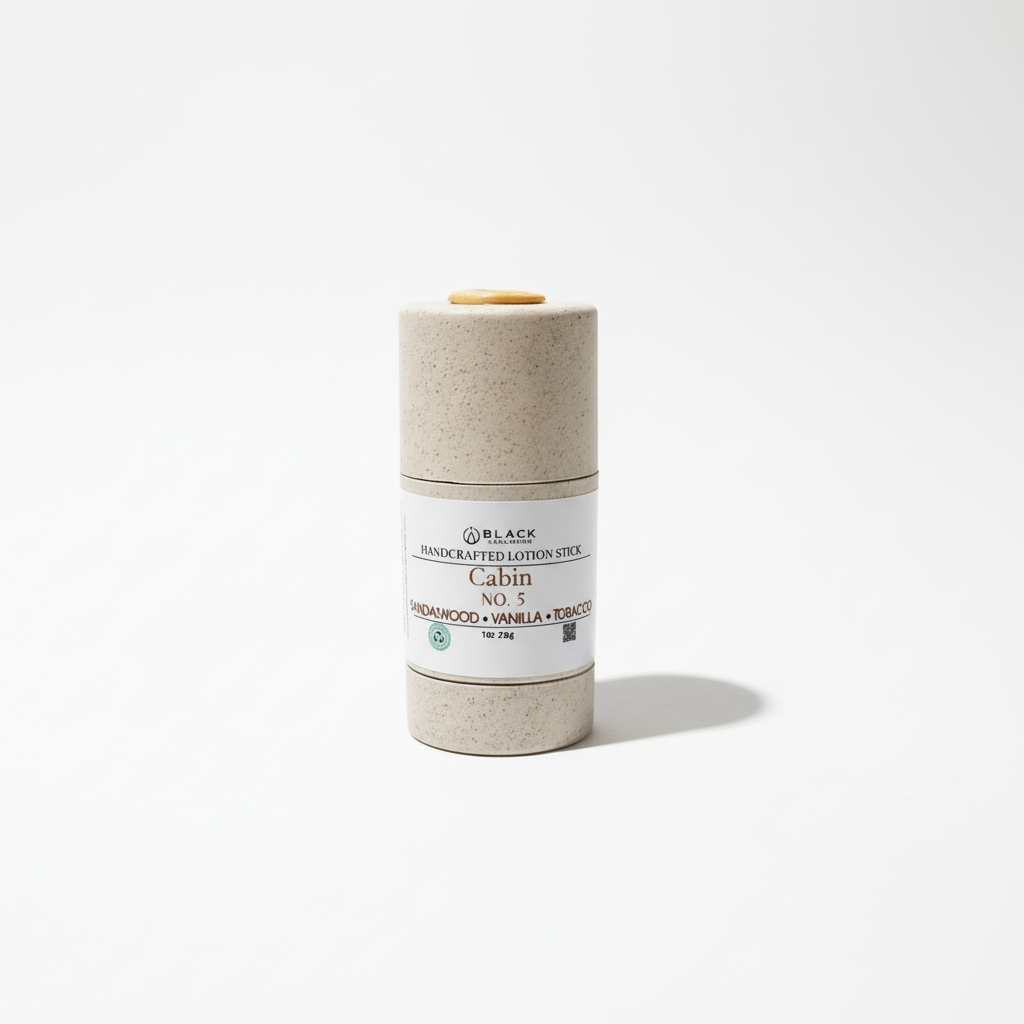 Handcrafted lotion stick in a cylindrical container on a white background