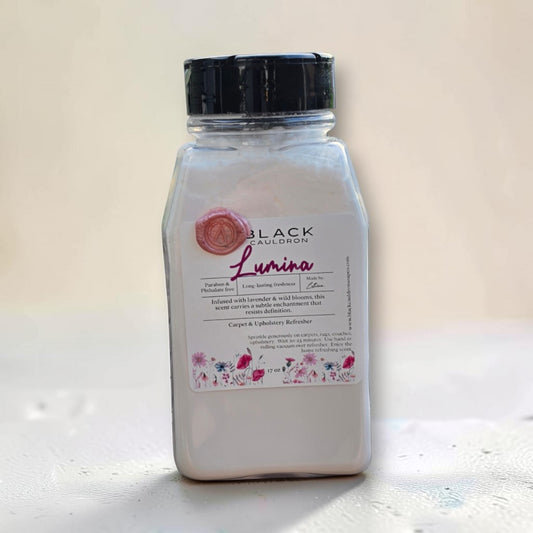 Featuring a white container of  carpet Refresher with a black cap and a floral label, set against a neutral beige background.