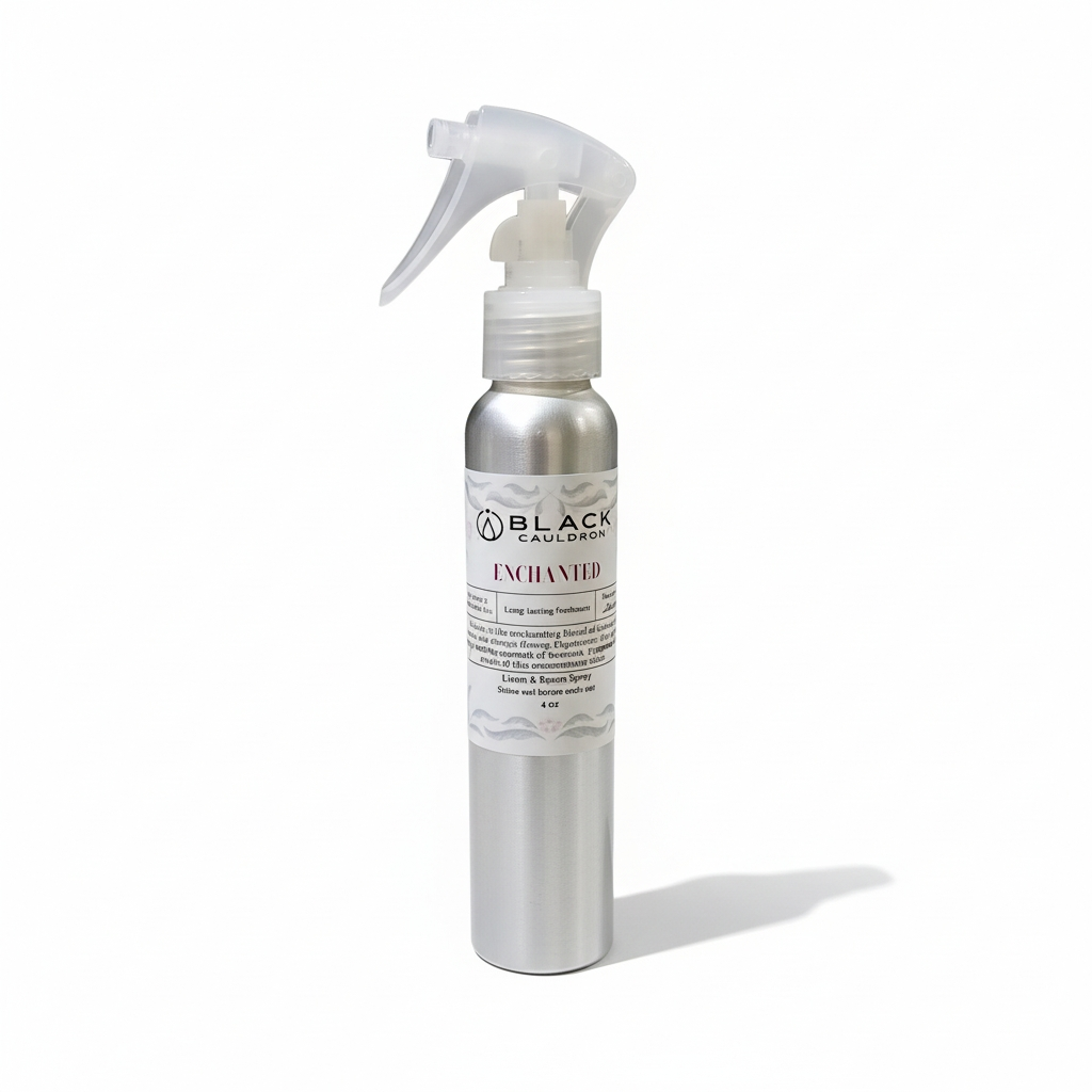 Silver spray bottle with a label on a white background.  Enchanted room and linen spray 
